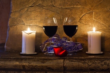 Red wine and candles on mantle